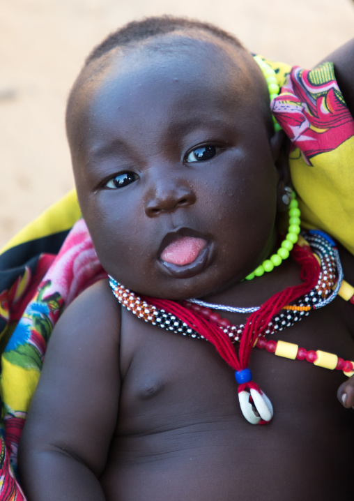 Larim tribe baby wearing necklaces, Boya Mountains, Imatong, South Sudan