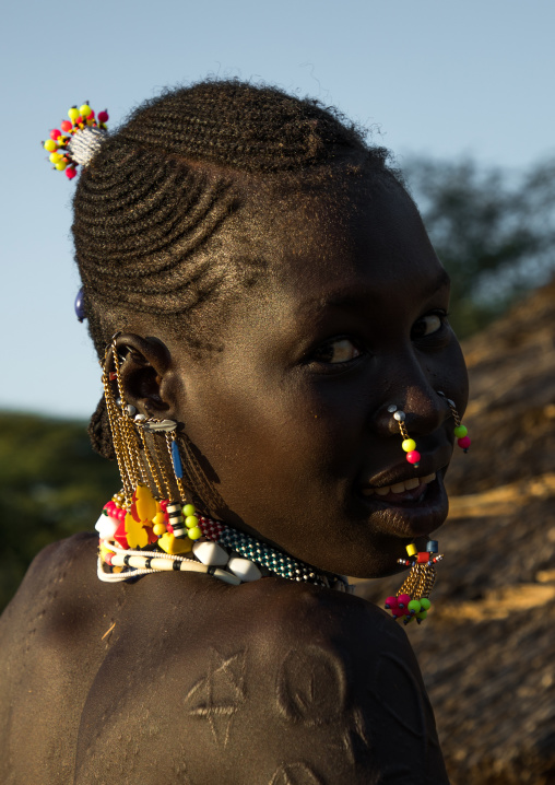 Portrait of a Larim tribe woman with traditional eaerrings, Boya Mountains, Imatong, South Sudan