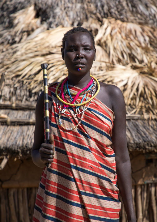 Portrait of a Larim tribe woman with a traditional stick, Boya Mountains, Imatong, South Sudan