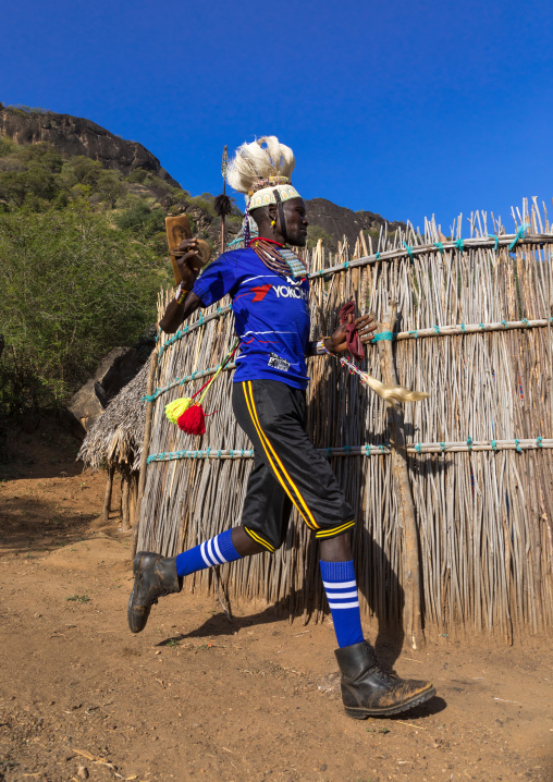 Larim tribe man dancing during a wedding ceremony, Boya Mountains, Imatong, South Sudan