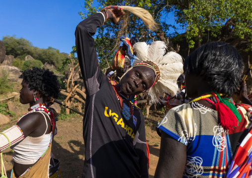 Larim tribe men and women dancing during a wedding celebration, Boya Mountains, Imatong, South Sudan