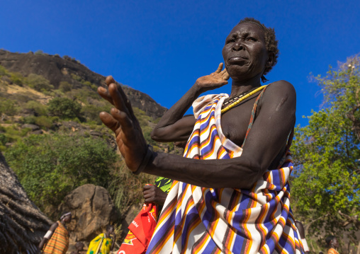Larim tribe woman dancing during a wedding celebration, Boya Mountains, Imatong, South Sudan