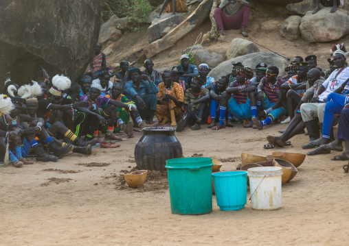 Larim tribe men drinking alcohol during a wedding ceremony, Boya Mountains, Imatong, South Sudan