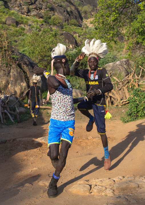 Larim tribe men dancing during a wedding ceremony, Boya Mountains, Imatong, South Sudan