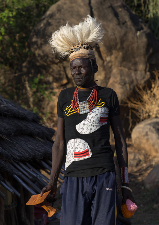 Larim tribe man with a wooden seat during a wedding ceremony, Boya Mountains, Imatong, South Sudan