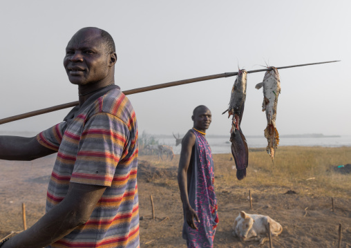 Mundari tribe men coming back from fishing, Central Equatoria, Terekeka, South Sudan