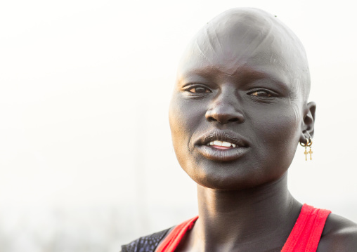 Portrait of a Mundari tribe woman with scarifications and bald head, Central Equatoria, Terekeka, South Sudan