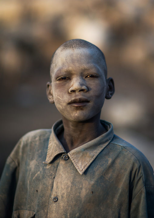Portrait of a Mundari tribe boy covered in ash to repel flies and mosquitoes in a cattle camp, Central Equatoria, Terekeka, South Sudan