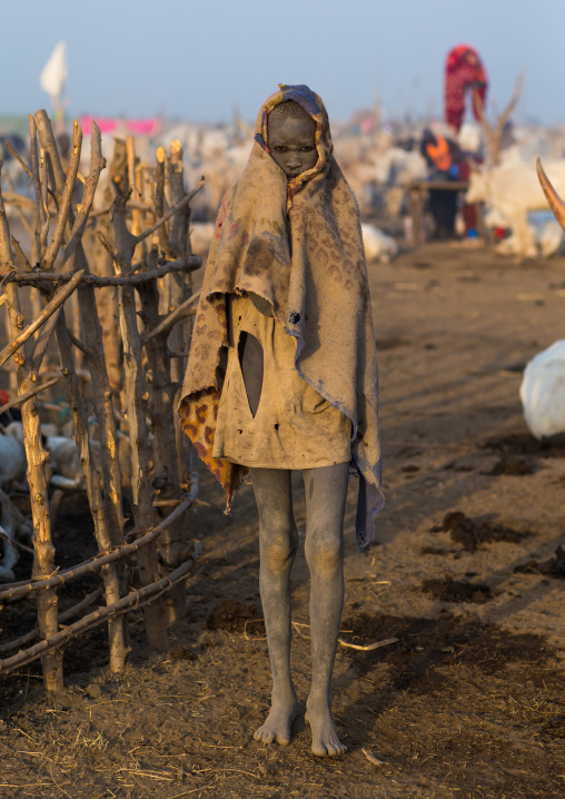 A Mundari tribe boy wrapped in blanket to fight the cold in a cattle camp, Central Equatoria, Terekeka, South Sudan