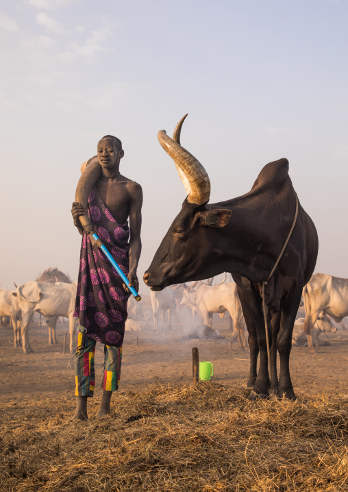Mundari tribe man with in a cow horn, Central Equatoria, Terekeka, South Sudan