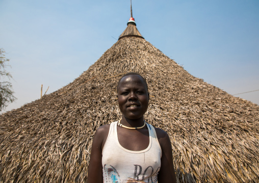 Portrait of a Mundari tribe woman in front of her hut, Central Equatoria, Terekeka, South Sudan
