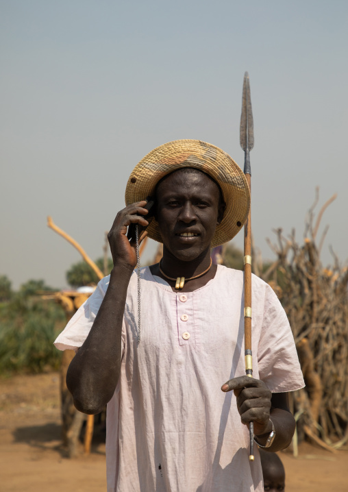 Mundari tribe man calling on his mobile phone, Central Equatoria, Terekeka, South Sudan