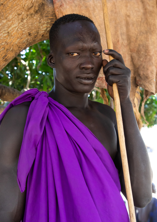 Mundari tribe man with purple clothes, Central Equatoria, Terekeka, South Sudan