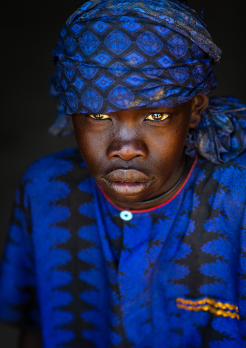 Portrait of a Mundari tribe boy with blue clothes, Central Equatoria, Terekeka, South Sudan