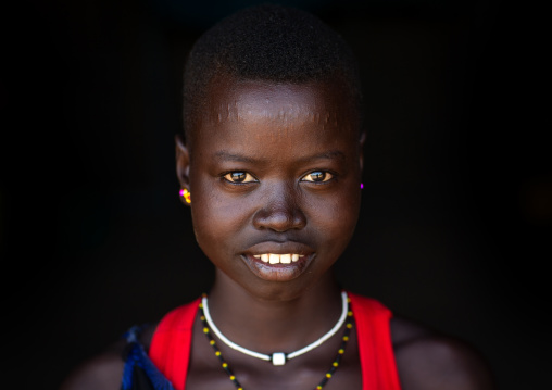 Portrait of a smiling Mundari young woman tribe, Central Equatoria, Terekeka, South Sudan