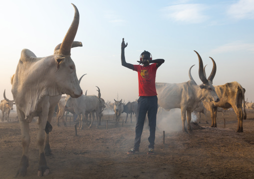A Mundari tribe student mimics the position of horns of his favourite cow, Central Equatoria, Terekeka, South Sudan