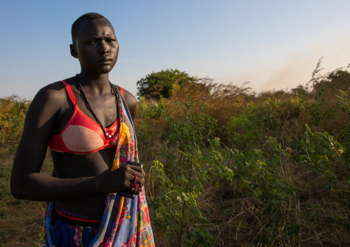 Portrait of a Mundari tribe womanin a field, Central Equatoria, Terekeka, South Sudan