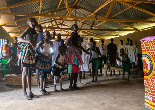 Mundari tribe people dancing and singing during a sunday mass in a church, Central Equatoria, Terekeka, South Sudan