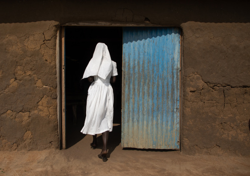 Mundari tribe nun entering a church, Central Equatoria, Terekeka, South Sudan