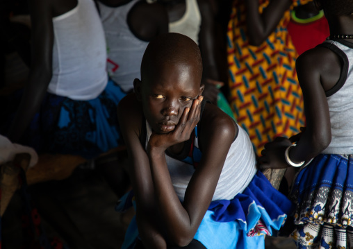 Mundari girl bored during a sunday mass, Central Equatoria, Terekeka, South Sudan