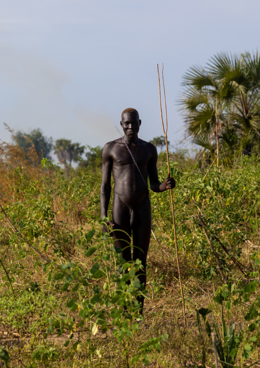 Naked Mundari tribe young man during a ceremony of adulthood, Central Equatoria, Terekeka, South Sudan