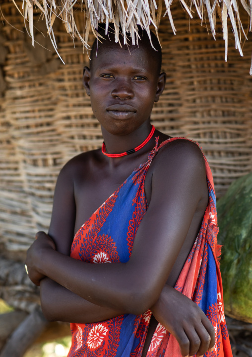 Portrait of a Mundari tribe woman under her house roof, Central Equatoria, Terekeka, South Sudan