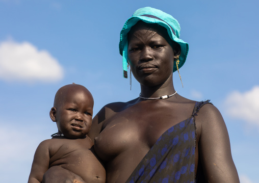 Portrait of a Mundari tribe woman with her child, Central Equatoria, Terekeka, South Sudan