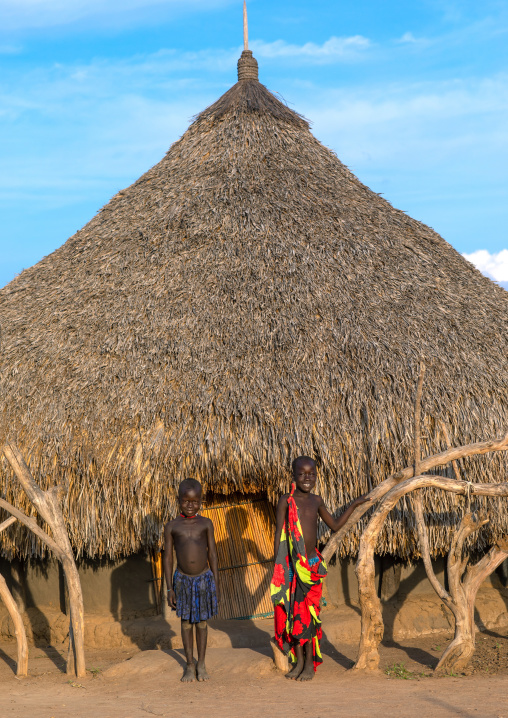 Mundari tribe children in front of a traditional house, Central Equatoria, Terekeka, South Sudan