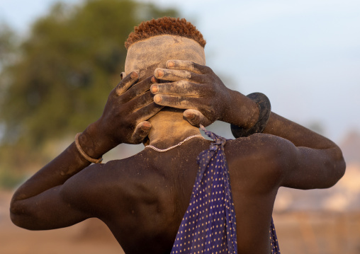 Mundari tribe boy covering with ash his body to protect from the mosquitoes and flies, Central Equatoria, Terekeka, South Sudan