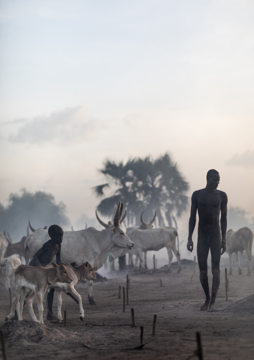 Mundari tribe people in the smoke of the bonfires used to repel the mosquitoes, Central Equatoria, Terekeka, South Sudan