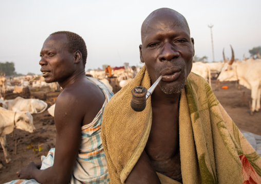 Mundari tribe man smoking a pipe, Central Equatoria, Terekeka, South Sudan