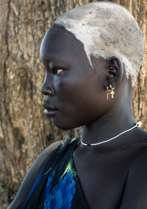 Portrait of a beautiful Mundari young woman with ash on the head to dye her hair in red, Central Equatoria, Terekeka, South Sudan