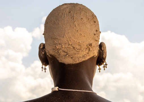 Mundari young woman with ash on the head to dye her hair in red, Central Equatoria, Terekeka, South Sudan