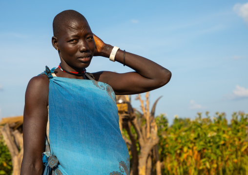 Portrait of a Mundari tribe woman in blue clothes, Central Equatoria, Terekeka, South Sudan
