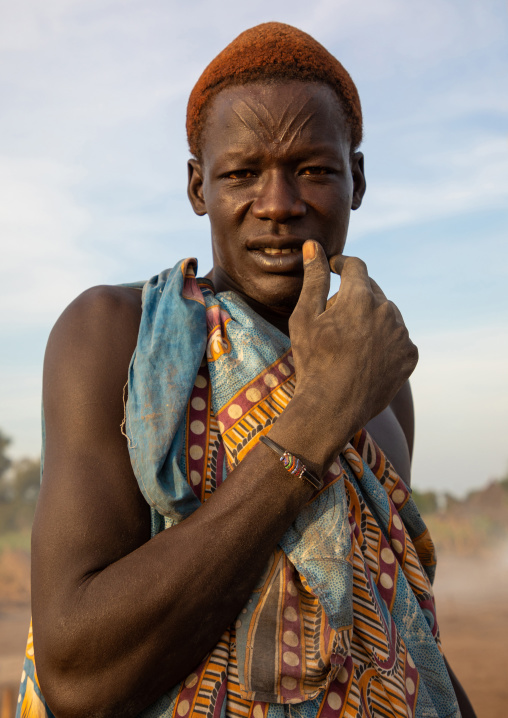 Portrait of a Mundari tribe man with hair dyed in orange with cow urine, Central Equatoria, Terekeka, South Sudan