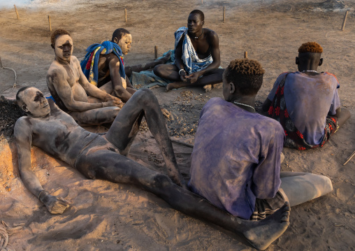 Mundari tribe men covering their bodies in ash to protect from the mosquitoes and flies bites, Central Equatoria, Terekeka, South Sudan