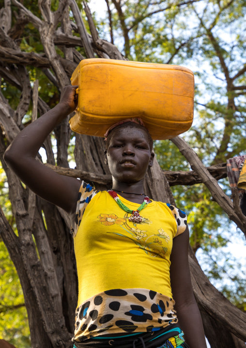 Portrait of a Lotuko tribe woman carrying a yellow jerrican on the head, Central Equatoria, Illeu, South Sudan