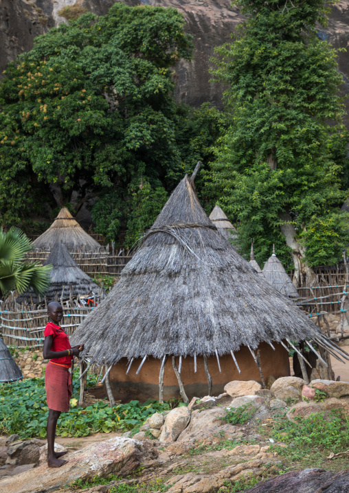 Girl in a Lotuko tribe village with thatched roof houses, Central Equatoria, Illeu, South Sudan
