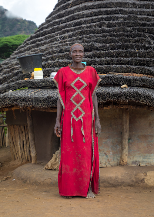Larim tribe woman in front of her traditional house, Boya Mountains, Imatong, South Sudan