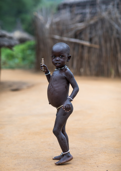 Portrait of a Larim tribe boy with a big belly, Boya Mountains, Imatong, South Sudan