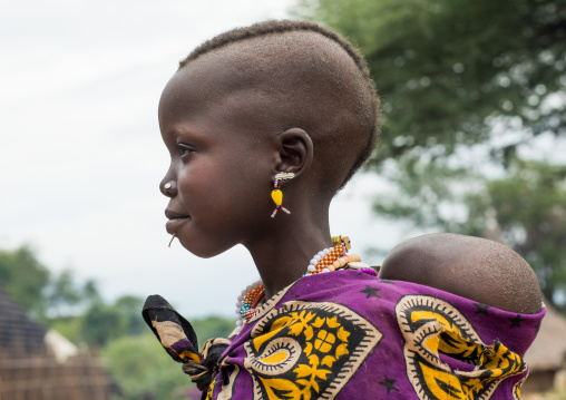 Portrait of a Larim tribe girl carrying a baby, Boya Mountains, Imatong, South Sudan