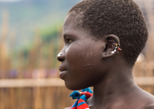 Larim tribe woman earrings made of nails, Boya Mountains, Imatong, South Sudan