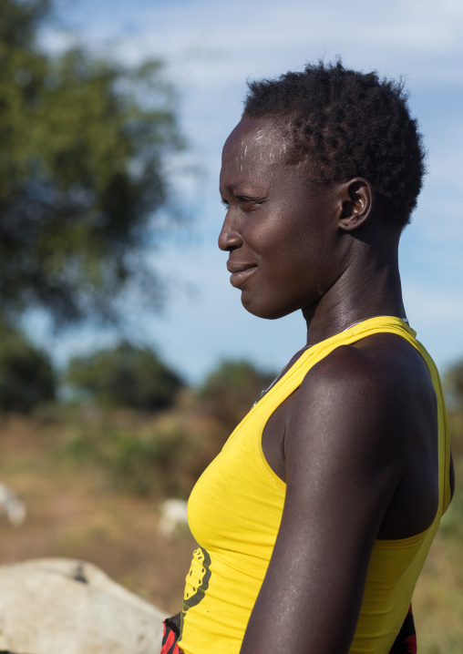 Portrait of a Mundari tribe woman with yellow shirt, Central Equatoria, Terekeka, South Sudan