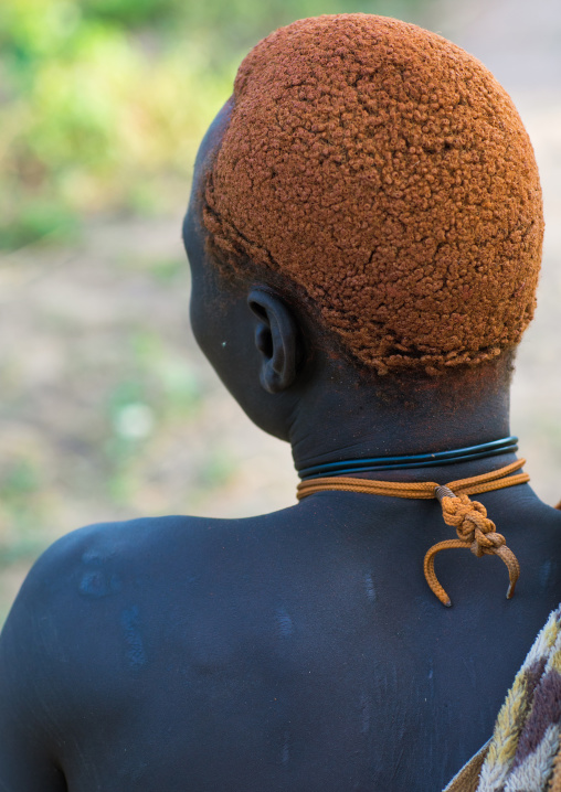 Rear view of a Mundari tribe man with hair dyed in orange with cow urine, Central Equatoria, Terekeka, South Sudan