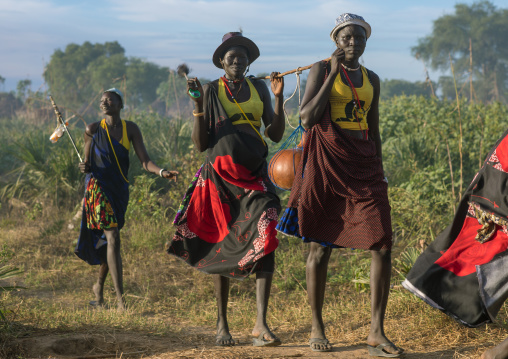 Mundari tribe women marching in line while celebrating a wedding, Central Equatoria, Terekeka, South Sudan