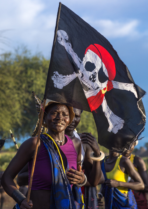 Mundari tribe women with a pirate flag while celebrating a wedding, Central Equatoria, Terekeka, South Sudan