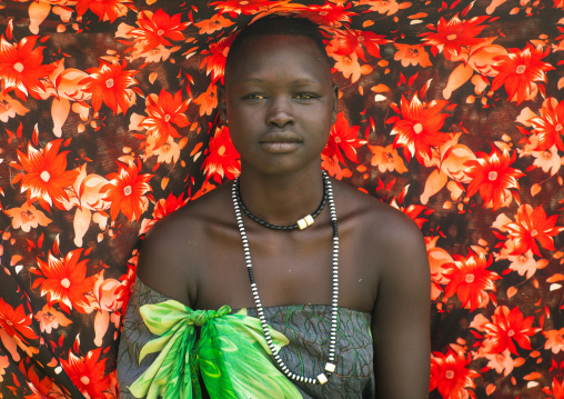 Portrait of a Mundari tribe woman using a colorful cloth to protect from the sun, Central Equatoria, Terekeka, South Sudan