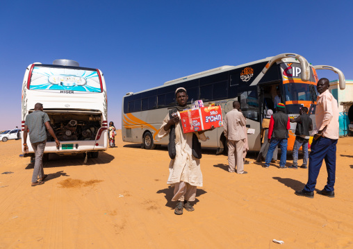 Sudanese man selling snacks to bus passengers, Khartoum State, Khartoum, Sudan