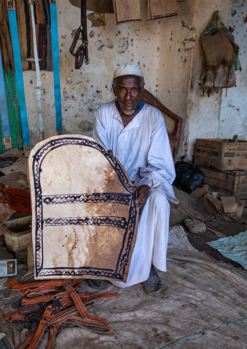 Sudanese man working on leather in the market, Kassala State, Kassala, Sudan