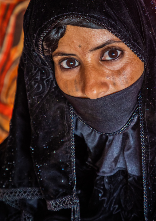 Portrait of a Rashaida tribe veiled woman inside her tent, Kassala State, Kassala, Sudan